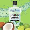 listerine coconut lime with water behind bottle