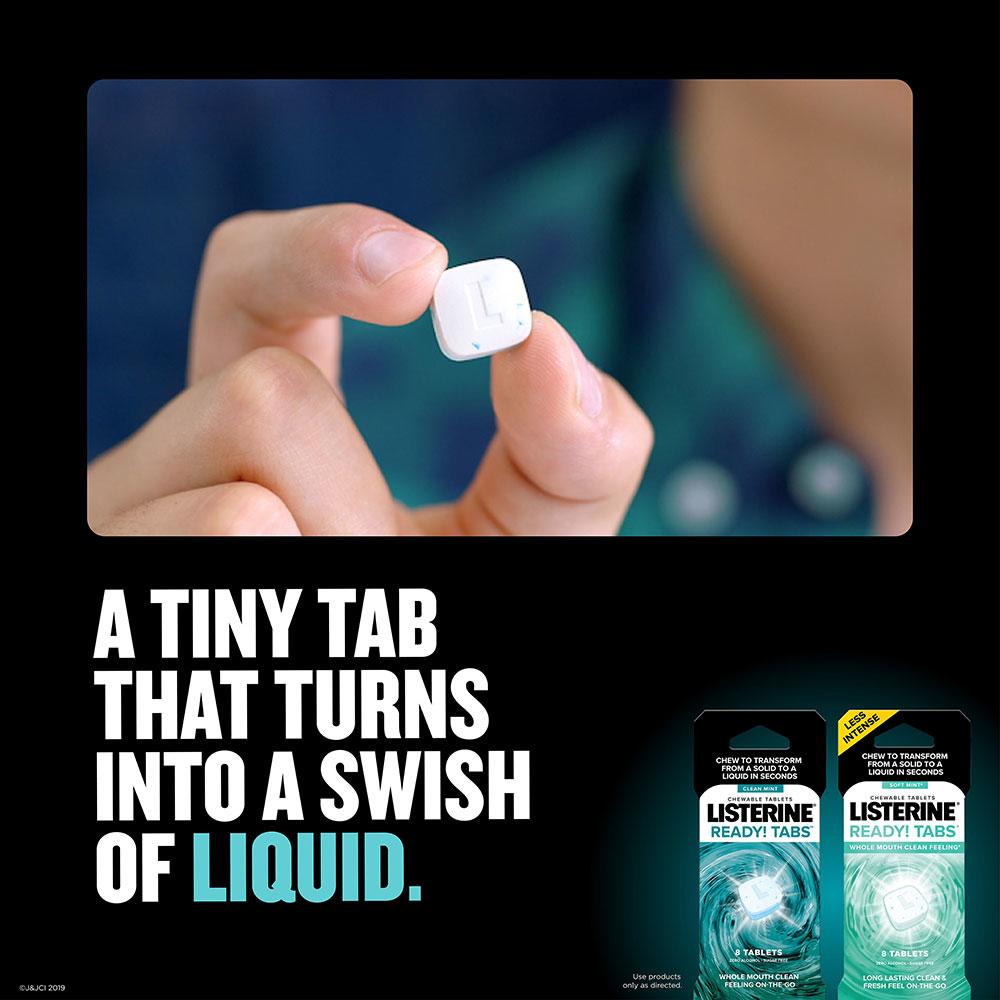 listerine ready tabs soft mint hand holding tablet 