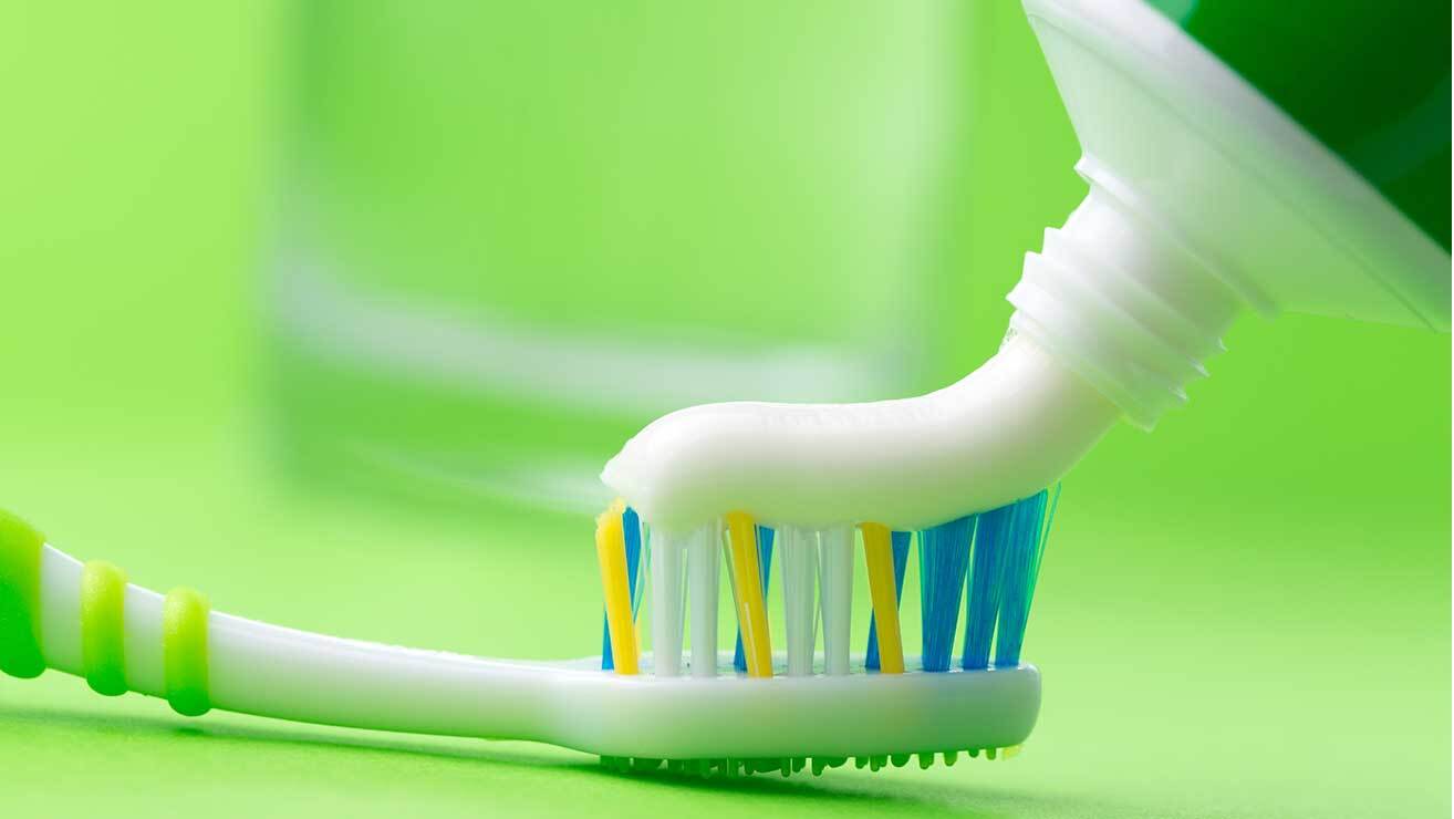 brush with fluoride toothbrush and toothpaste
