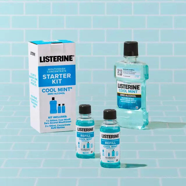 A Starter Pack of Cool Mint Zero Concentrate that includes 2 small refill bottles and a bottle of Listerine Cool Mint Zero is shown on a powder blue tile background.