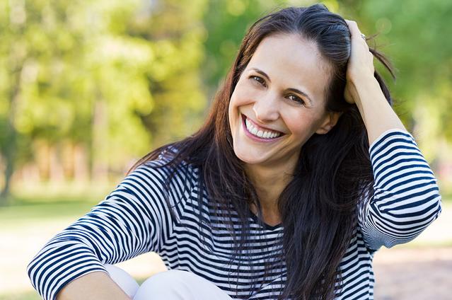 Woman smiling with sensitive teeth