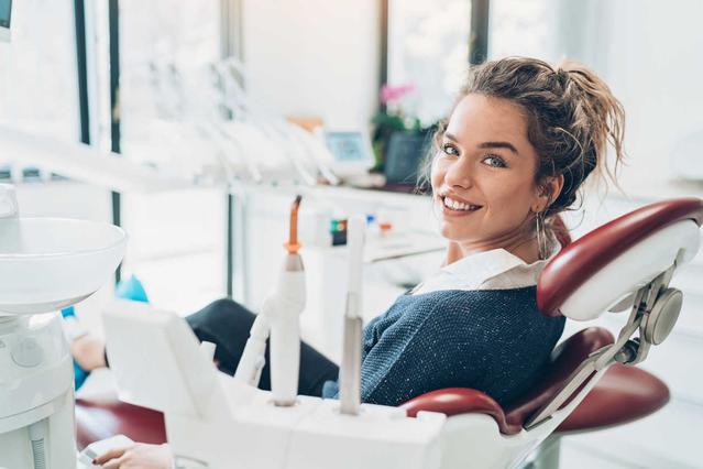 Woman sat in dentist chair