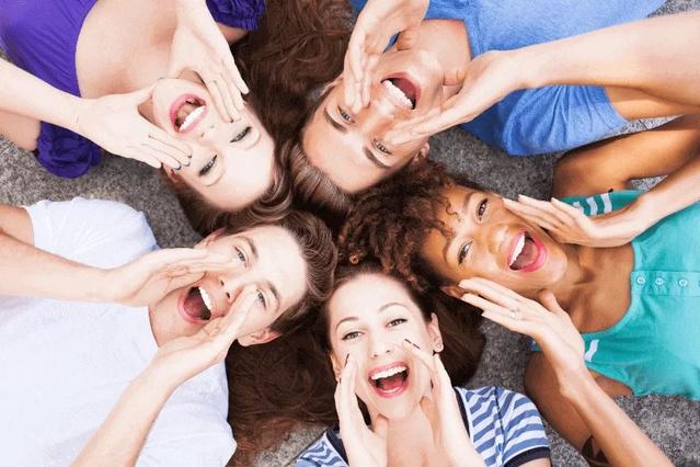 Group of people smiling with white teeth