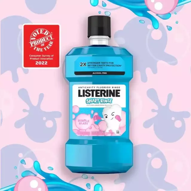 A Listerine Smart Rinse Bubble Blast mouthwash bottle is displayed behind a light pink bubble gum background.  A red seal mentioning a “Product of the Year” claim is shown to its left.
