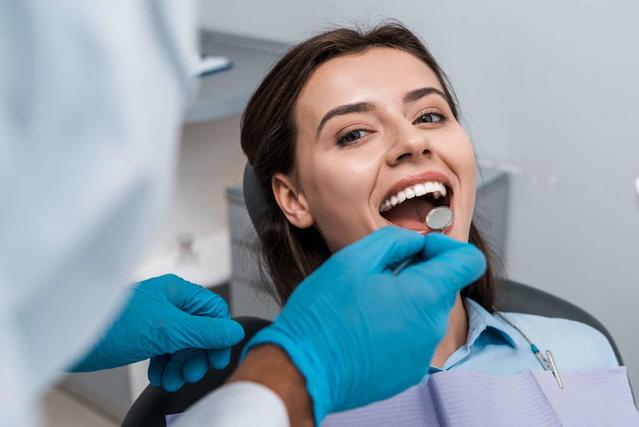 Woman with white teeth at dental checkup