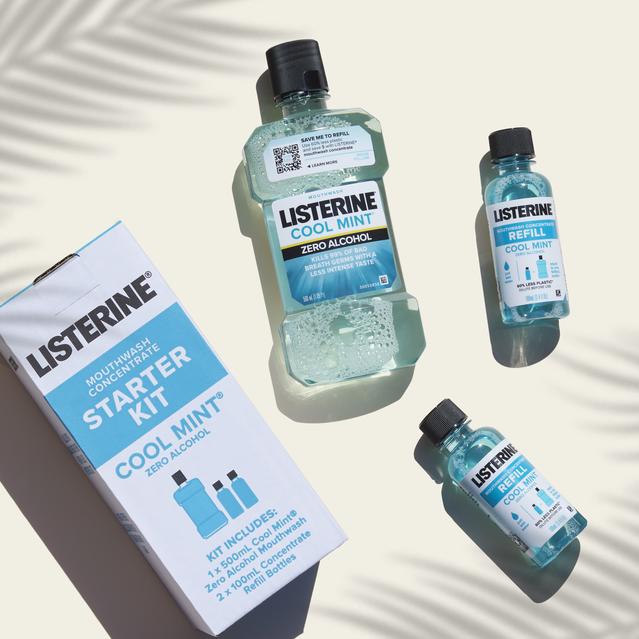 Starter Kit: Graphic of Listerine Concentrate box and contents laid flat on a beige background where a palm’s soft shadow is part of the background too